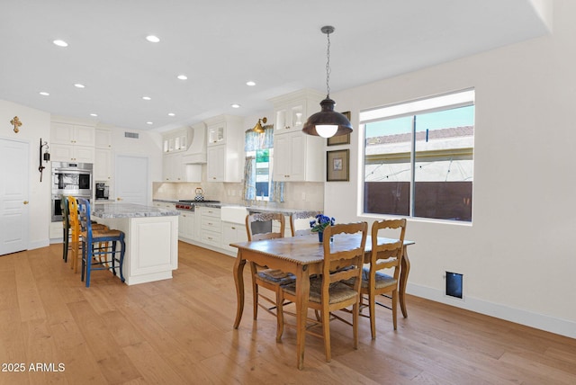 13914 E Laurel Ln, Scottsdale, AZ 85259 - dining space featuring a healthy amount of sunlight, light wood-style floors, and recessed lighting