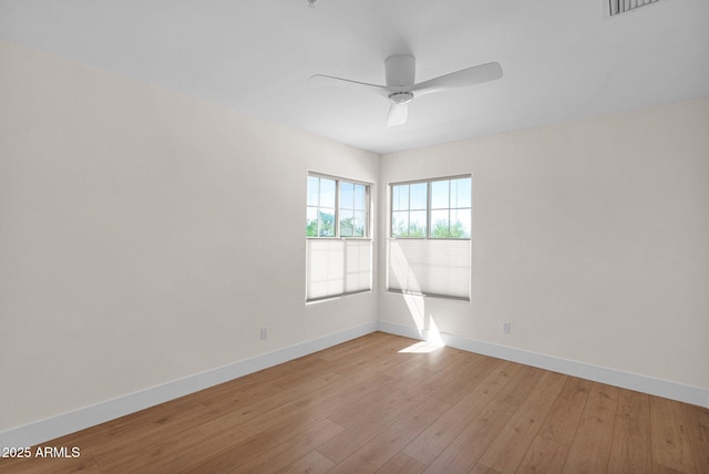 13914 E Laurel Ln, Scottsdale, AZ 85259 - spare room featuring light wood finished floors, baseboards, and ceiling fan