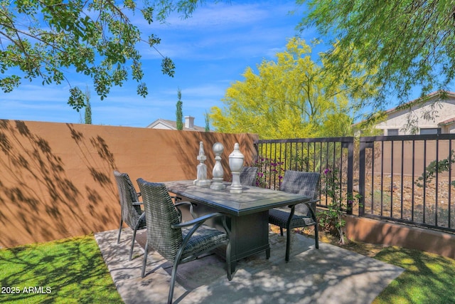 13914 E Laurel Ln, Scottsdale, AZ 85259 - view of patio featuring outdoor dining space and fence