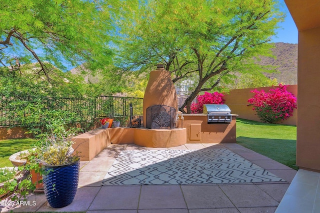 13914 E Laurel Ln, Scottsdale, AZ 85259 - view of patio featuring a fenced backyard and area for grilling