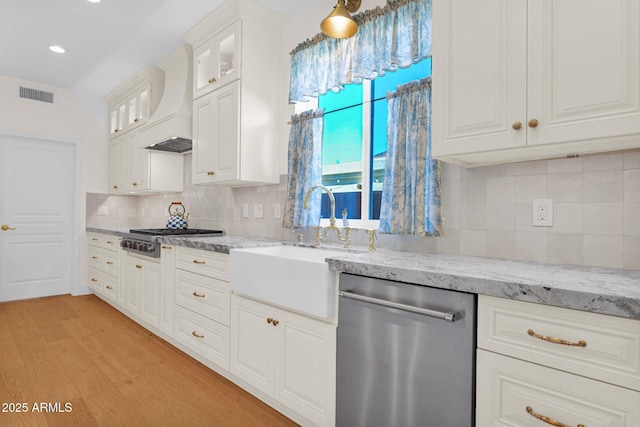13914 E Laurel Ln, Scottsdale, AZ 85259 - kitchen featuring tasteful backsplash, stainless steel appliances, light wood-style flooring, custom range hood, and visible vents