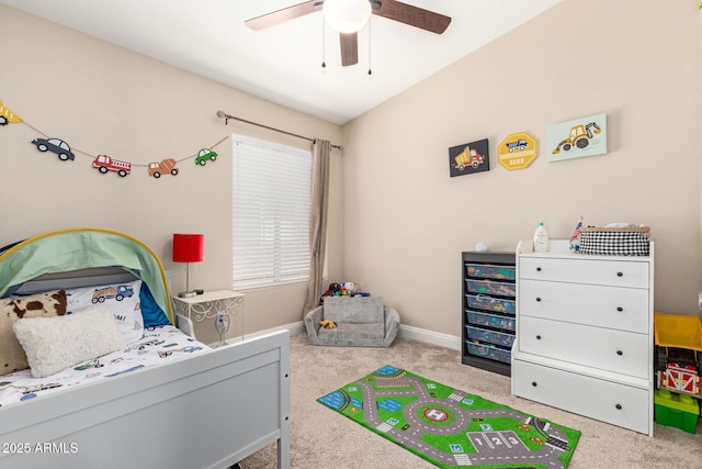 carpeted bedroom featuring baseboards and ceiling fan