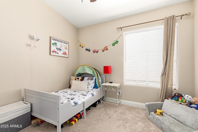 carpeted bedroom with baseboards, multiple windows, and ceiling fan