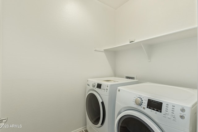 washroom with washer and clothes dryer