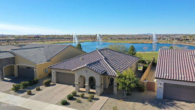 birds eye view of property with a water view