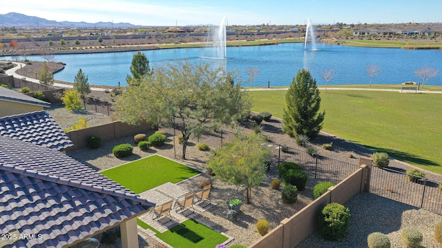 drone / aerial view featuring a water and mountain view