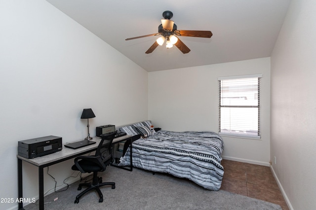bedroom with baseboards, a ceiling fan, and lofted ceiling