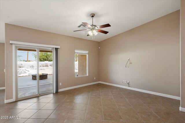 2487 S Conestoga Rd, Apache Junction, AZ 85119 - empty room with ceiling fan and tile patterned flooring