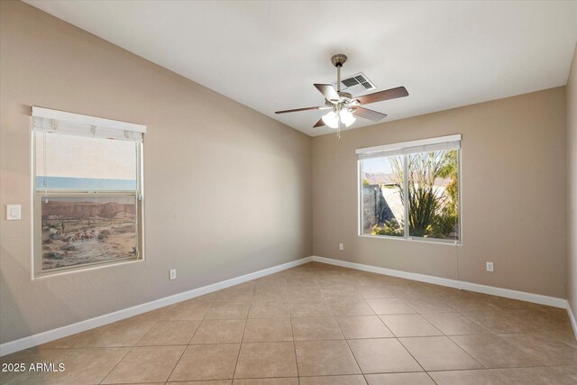 2487 S Conestoga Rd, Apache Junction, AZ 85119 - empty room with a ceiling fan, vaulted ceiling, and light tile patterned floors