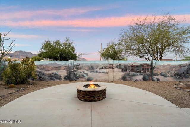 2487 S Conestoga Rd, Apache Junction, AZ 85119 - patio terrace at dusk with a fire pit and a patio
