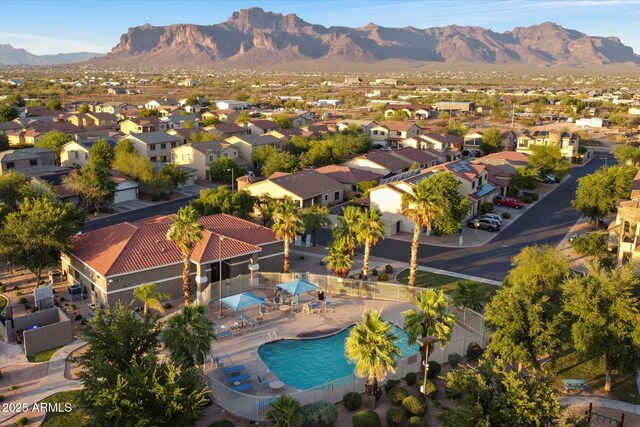 2487 S Conestoga Rd, Apache Junction, AZ 85119 - aerial view of residential area with a mountain backdrop and a pool area