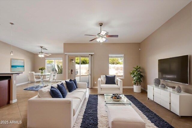 2487 S Conestoga Rd, Apache Junction, AZ 85119 - living room with a ceiling fan, light tile patterned floors, and plenty of natural light