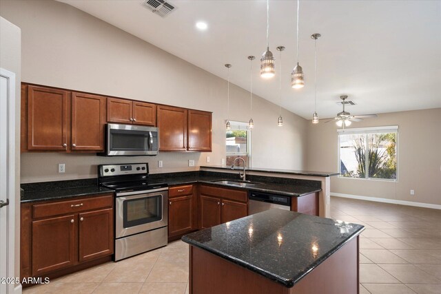 2487 S Conestoga Rd, Apache Junction, AZ 85119 - kitchen with appliances with stainless steel finishes, light tile patterned floors, a peninsula, high vaulted ceiling, and a ceiling fan