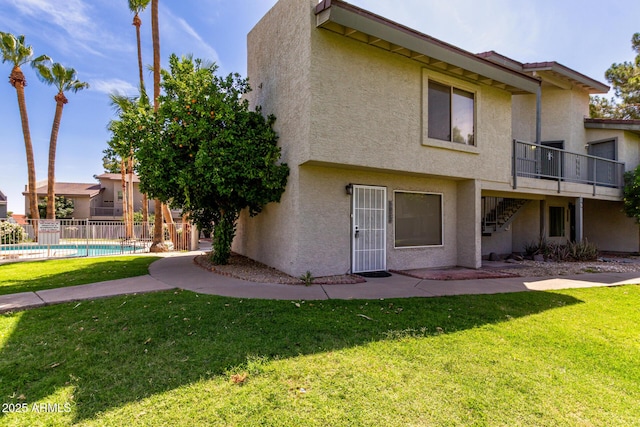 19601 N 7th St Unit 1022, Phoenix, AZ 85024 - rear view of property featuring stairway, stucco siding, and a deck