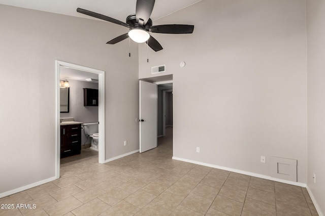 19601 N 7th St Unit 1022, Phoenix, AZ 85024 - unfurnished bedroom with light tile patterned floors, a high ceiling, ensuite bath, and ceiling fan