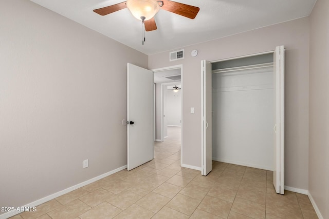 19601 N 7th St Unit 1022, Phoenix, AZ 85024 - unfurnished bedroom featuring light tile patterned flooring, a ceiling fan, and a closet
