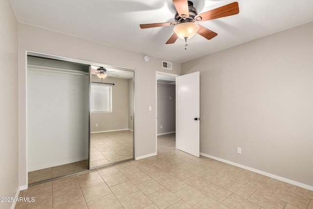 19601 N 7th St Unit 1022, Phoenix, AZ 85024 - unfurnished bedroom with a closet, light tile patterned flooring, and ceiling fan