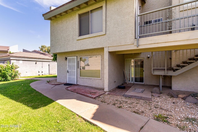 19601 N 7th St Unit 1022, Phoenix, AZ 85024 - entrance to property featuring stucco siding, a yard, and a patio area