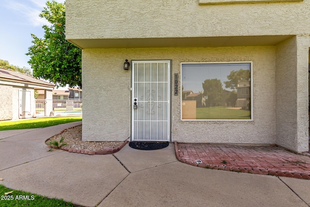 19601 N 7th St Unit 1022, Phoenix, AZ 85024 - doorway to property with stucco siding and a patio
