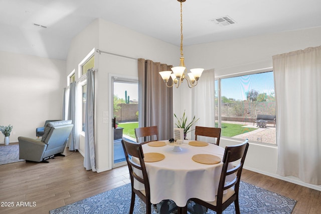 4611 E Night Glow Dr, Cave Creek, AZ 85331 - dining room with a chandelier, wood finished floors, plenty of natural light, and baseboards