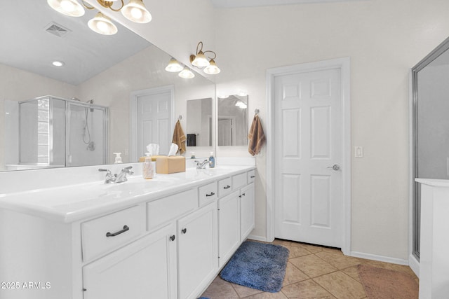 4611 E Night Glow Dr, Cave Creek, AZ 85331 - bathroom featuring double vanity, a stall shower, tile patterned floors, and a chandelier