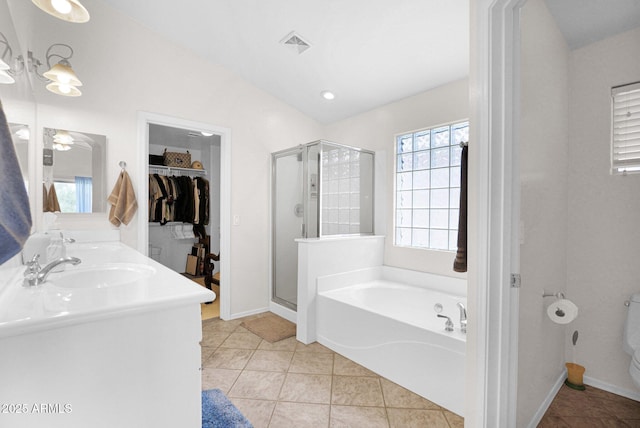 4611 E Night Glow Dr, Cave Creek, AZ 85331 - bathroom featuring a bath, a shower stall, tile patterned floors, baseboards, and double vanity