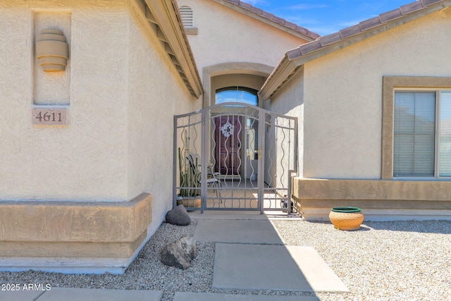 4611 E Night Glow Dr, Cave Creek, AZ 85331 - view of exterior entry featuring a gate and stucco siding