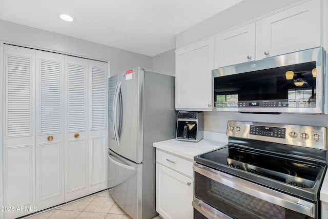 1511 W Mesquite St, Chandler, AZ 85224 - kitchen with light countertops, stainless steel appliances, white cabinets, and light tile patterned floors