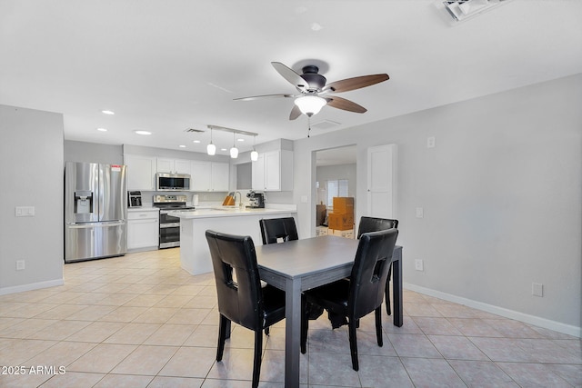 1511 W Mesquite St, Chandler, AZ 85224 - dining room with light tile patterned floors, baseboards, ceiling fan, and visible vents