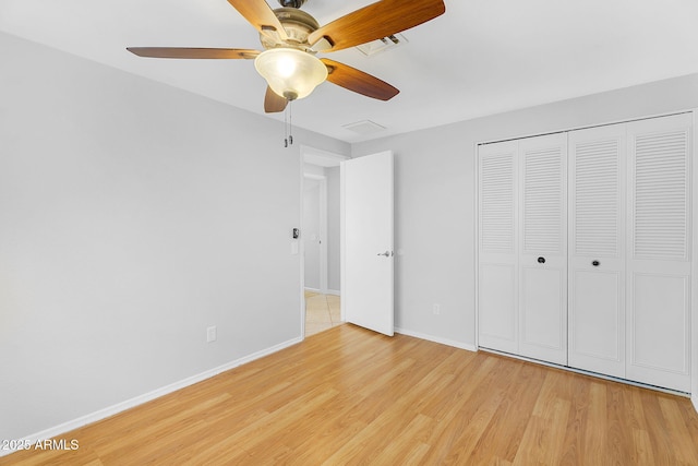 1511 W Mesquite St, Chandler, AZ 85224 - unfurnished bedroom featuring visible vents, a closet, baseboards, ceiling fan, and light wood-style flooring