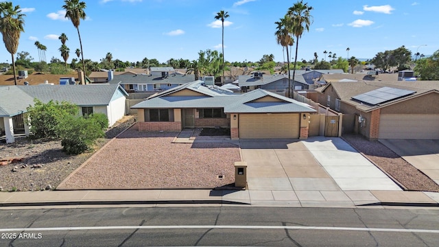 1511 W Mesquite St, Chandler, AZ 85224 - view of front of home with a residential view, fence, an attached garage, brick siding, and concrete driveway