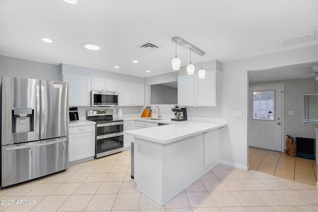 1511 W Mesquite St, Chandler, AZ 85224 - kitchen featuring a sink, stainless steel appliances, white cabinetry, and visible vents