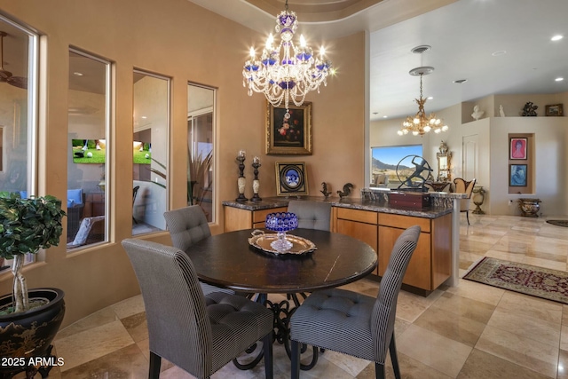 dining area with an inviting chandelier