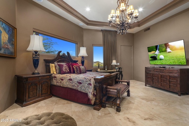 bedroom featuring a towering ceiling, a notable chandelier, and a tray ceiling