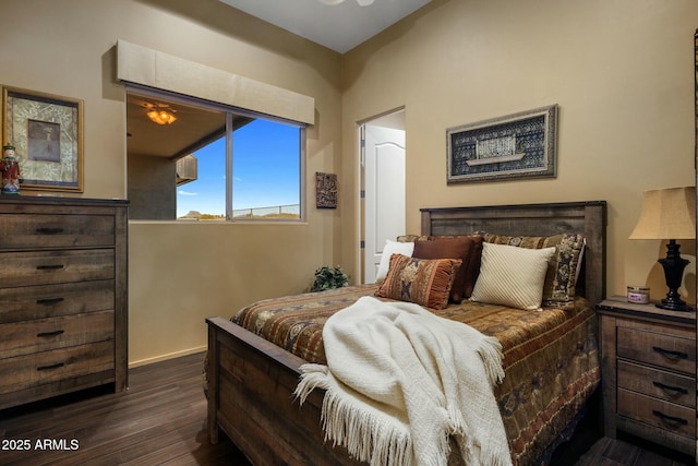 bedroom featuring dark hardwood / wood-style flooring