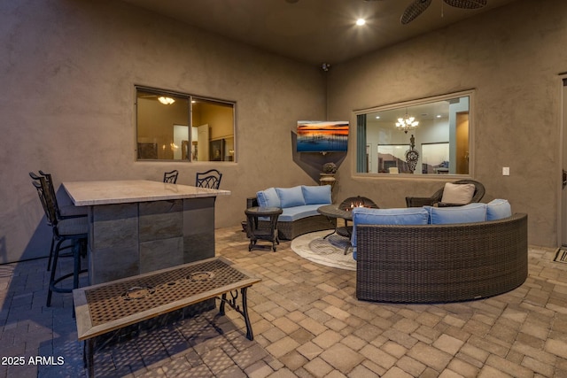 view of patio with outdoor lounge area and ceiling fan