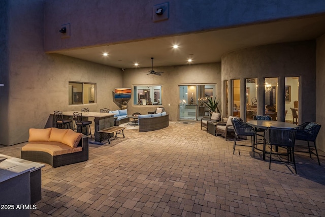 view of patio / terrace with an outdoor living space and ceiling fan