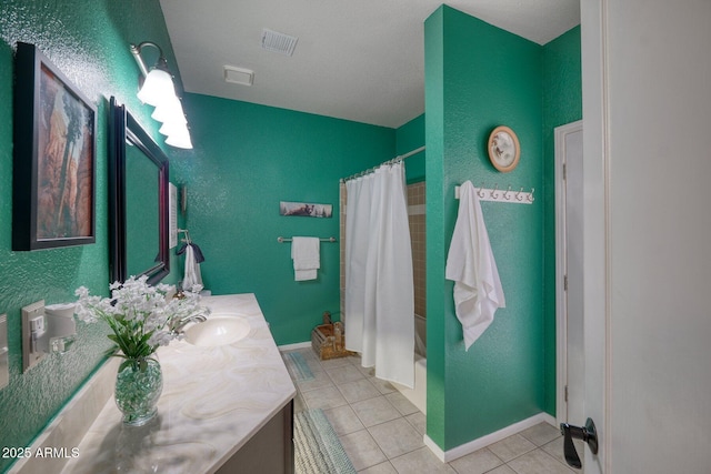 full bath with baseboards, vanity, visible vents, and tile patterned floors