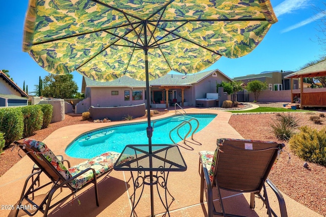 view of swimming pool with a fenced backyard, a fenced in pool, and a patio