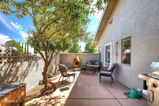 view of patio / terrace featuring outdoor lounge area and a fenced backyard