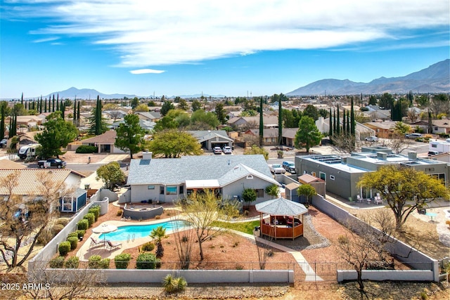 birds eye view of property with a residential view and a mountain view