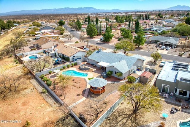 birds eye view of property with a residential view and a mountain view