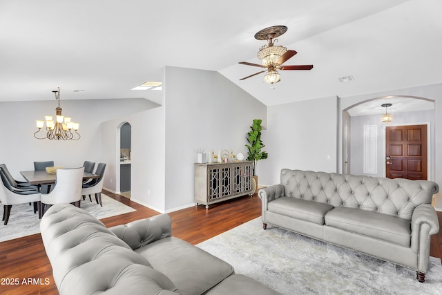 8781 S Mill Ave, Tempe, AZ 85284 - living area with visible vents, ceiling fan with notable chandelier, wood finished floors, arched walkways, and lofted ceiling