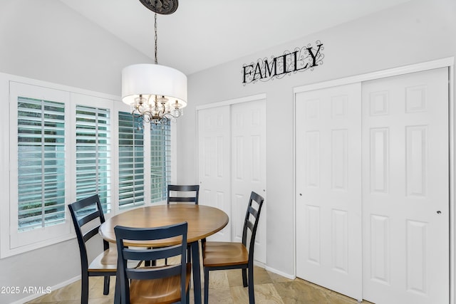 8781 S Mill Ave, Tempe, AZ 85284 - dining area with baseboards, an inviting chandelier, and vaulted ceiling