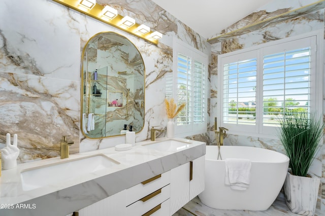 8781 S Mill Ave, Tempe, AZ 85284 - full bathroom featuring a sink, a freestanding tub, stone wall, and double vanity