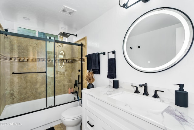 8781 S Mill Ave, Tempe, AZ 85284 - full bath with visible vents, vanity, toilet, and shower / bath combination with glass door