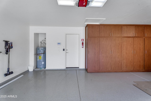 8781 S Mill Ave, Tempe, AZ 85284 - garage featuring electric water heater, a garage door opener, and baseboards