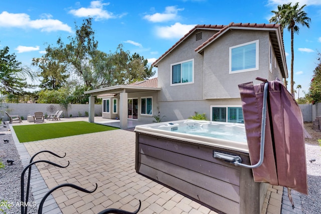 8781 S Mill Ave, Tempe, AZ 85284 - rear view of house featuring a hot tub, fence, a tile roof, stucco siding, and a patio area