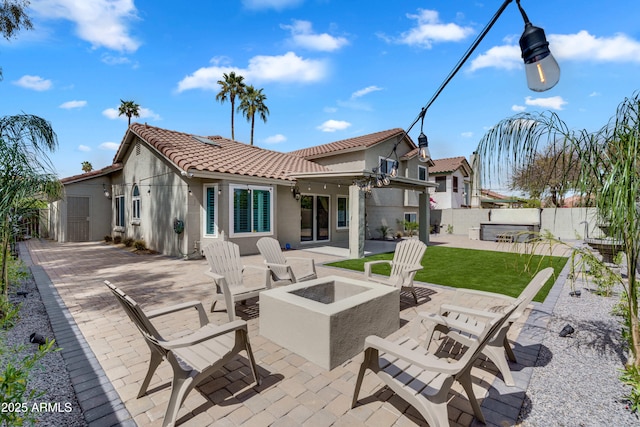 8781 S Mill Ave, Tempe, AZ 85284 - back of property featuring a patio, fence, stucco siding, a fire pit, and a tile roof