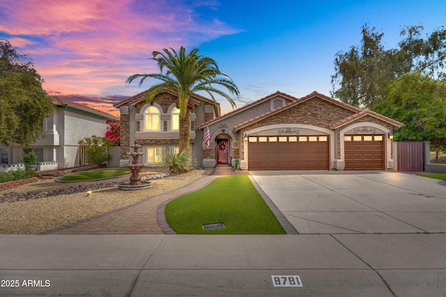 8781 S Mill Ave, Tempe, AZ 85284 - view of front of property with a tile roof, an attached garage, driveway, and stucco siding